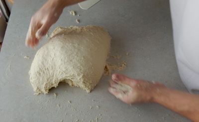 Pick the dough up with 1/4 turn and do it again