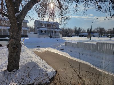 A snowy front yard on a bright morning, Regina, Saskatchewan