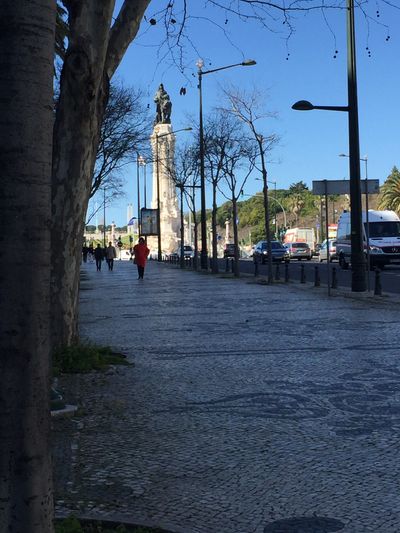 patterned cobblestones with monuments in the distance
