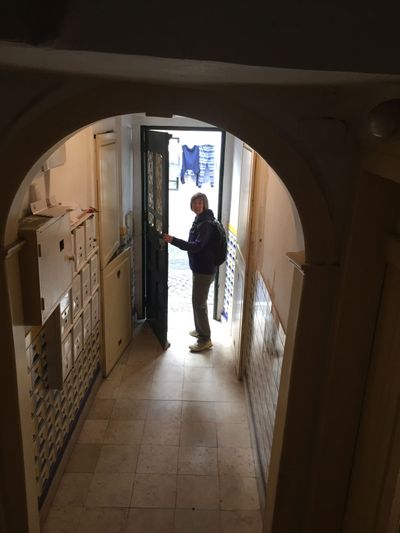 Cindy at the front door of our AirBnb in Lisbon