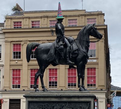 traffic cone hat on a statue, as they do in Glasgow