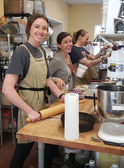 Amy Corliss with two of her bakers, Chloe and Jenn