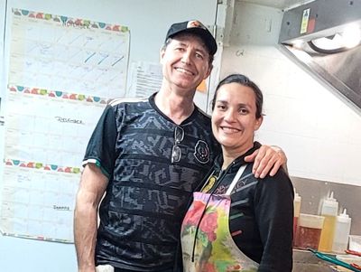 Brad and Claudia, standing in their restaurant kitchen