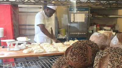 baker shaping baguettes at Silver Moon Bakery
