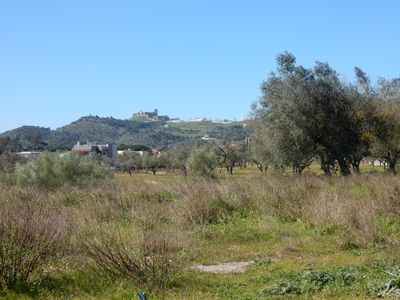 The castle is far away, up a large hill