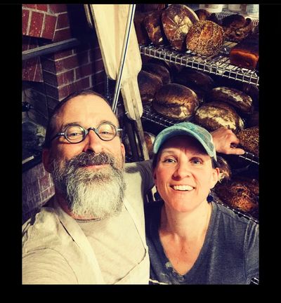 Charlie and Hilde, in front of their brick oven