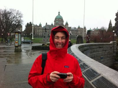 Cindy taking a picture in the rain in Victoria, BC